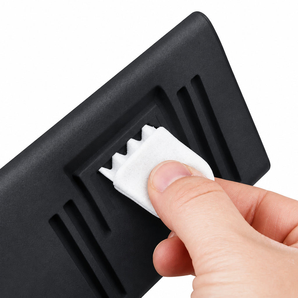 Hand pressing the push-button lock on a black tissue dispenser